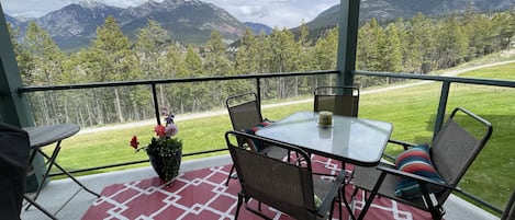 Quiet 2nd floor balcony overlooking the green space, walking path and mountains