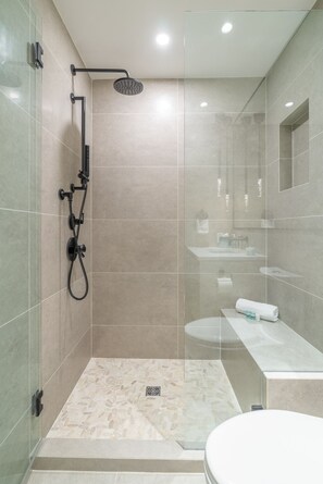 Ensuite bathroom with a walk-in shower, heated floors, & waterfall shower.