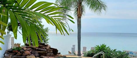 Relax by the pool and watch activity on the Laguna Madre