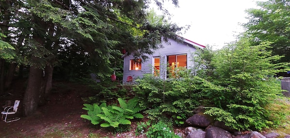 Twilight looking up to the cottage from the river.