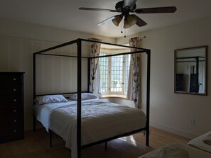 Bedroom 1 with 1 Queen bed and 2 twins.