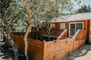 The Bison cabin w/ queen bedroom and 2 chairs that fold into singles in livingrm