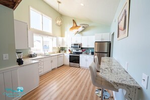 A large kitchen with everything you need to prepare a family-sized meal