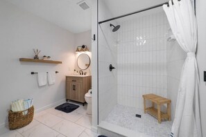 The modern bathroom provides all the amenities you need for a comfortable stay.