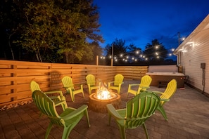 Enjoy the outdoors around the stone fire pit!