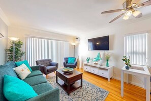 Bright, breezy and comfortable living room - includes a pull out sofa bed, AC, Smart Google TV andceiling fan