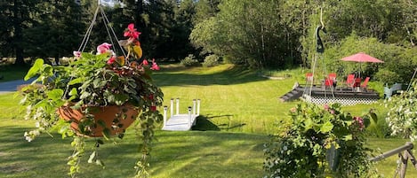 Looking out from the front porch over the front yard and Tiki deck.