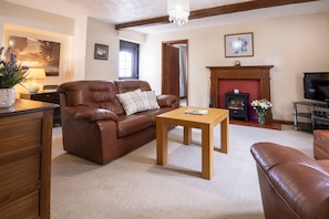 Ground floor:  Comfortable sitting room with electric flame fire