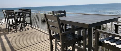 Large Balcony which includes 2 Bar height tables & 8 bar height chairs.  Spectacular ocean view!  See & hear the waves break. 
