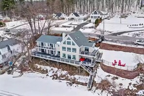 Aerial view of the house with surrounding area.