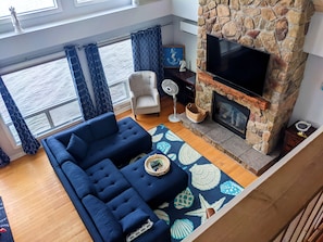 Enjoy great views from the living room and cozy up next to the fireplace.