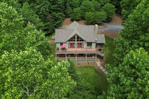 Rear of home faces lake, upper and lower decks.