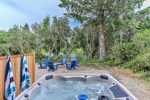 Feel your muscles relax in the the private hot tub overlooking the quiet waters of the Grand Canal. 