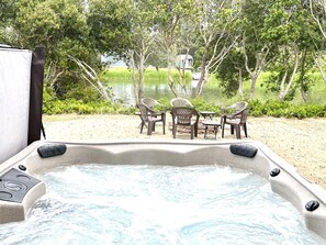 Dip into the hot tub off the back patio, and let your shoulders relax as you watch the calm canal waters lap along the shore.