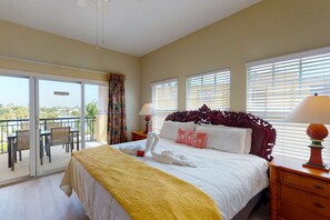 King size bed in Master with access to a waterfront view balcony.