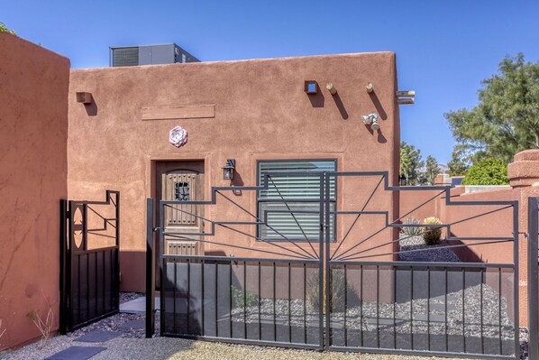 Front entrance to free standing guest house with private fenced yard