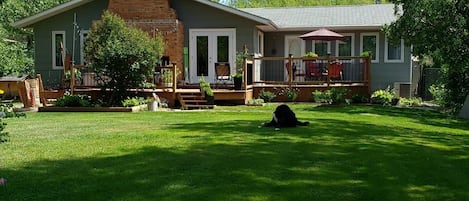 Back yard with full chain link fence & entrance to 8th green! Beautiful decks