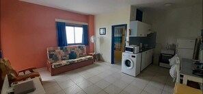 Lounge area with double sofa bed. Kitchenette, private bathroom & shower.