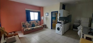 Lounge area with double sofa bed. Kitchenette, private bathroom & shower.