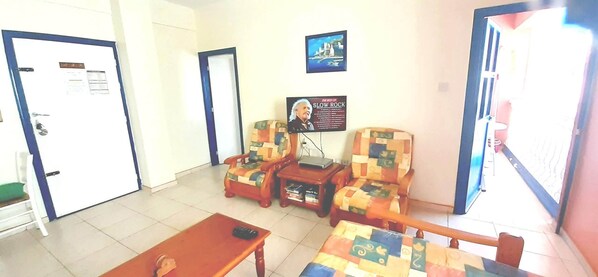 Open plan living area  with flat screen TV, free wifi/