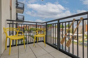 The balcony provides a perfect spot for enjoying the fresh air. 