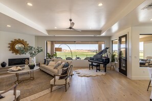 Upstairs Living Room - With a beautiful grand piano and a gorgeous view of The Ledges Golf Course this is the perfect entry to a home.