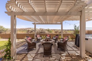 Pergola and Outdoor Firepit - Enjoy the weather under the pergola while sitting in our comfortable patio furniture.