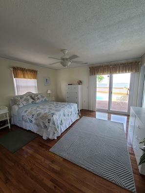 Master bedroom with access to pool and river