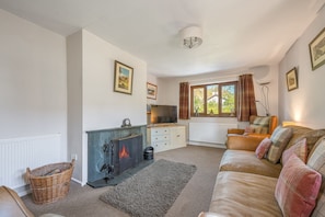 Brook Cottage Coniston sitting room with log fire
