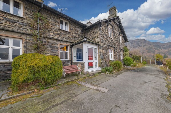 Rose Bank Cottage in Coniston with Lake District fells beyond