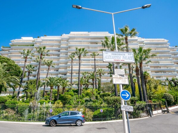 Sky, Plant, Car, Property, Building, Wheel, Street Light, Vehicle, Infrastructure