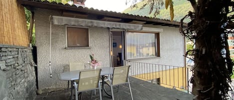 Building, Table, Furniture, Plant, Property, Window, Chair, Sky, Door, House