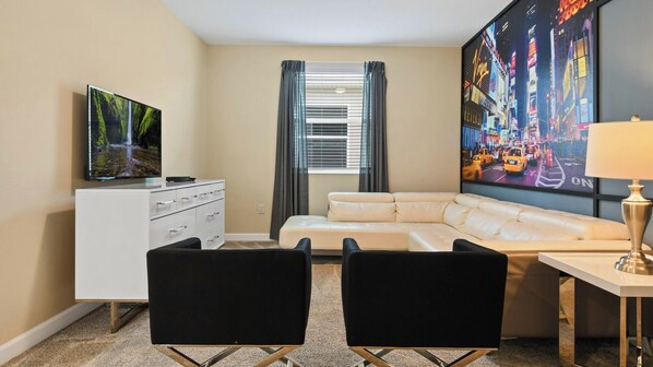 Family fun central! This room's got comfy couches, a big screen & board games galore for epic movie nights