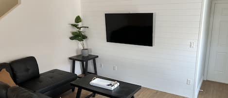 Living Room, Smart TV with Live TV and other streaming programs.