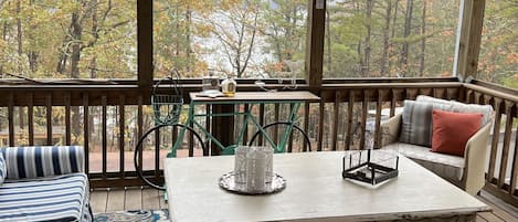 Screened in porch great place to enjoy the lake.