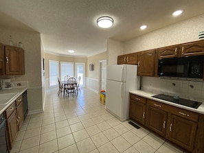 Huge kitchen with eat in area that seats 4 and extra chairs available