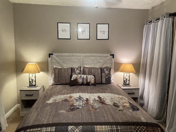 Bedroom 1 located on first floor has one queen bed as well as a smart TV