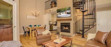Open living area with wood burning fire place.