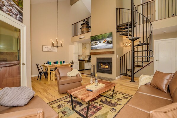 Open living area with wood burning fire place.