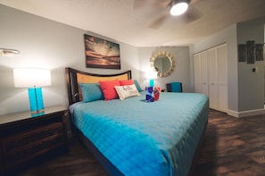 King bed in main bedroom. Window air conditioning