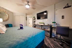 King size bed, TV, work station, pack 'n' play in the closet