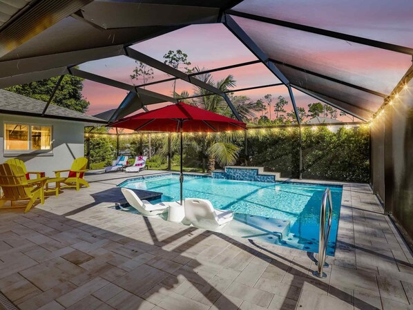 Unwind under the screened lanai and enjoy the magical ambiance of the pool lit up at night.