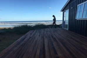 Large deck to sit and enjoy the beach, eat al fresco or star gaze