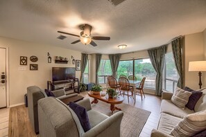 Living Room with a sofa sleeper and Dining Room!