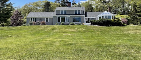 Photo of the main house with sprawling lawn
