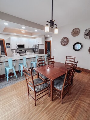 Dining room situated between the kitchen and living room. 