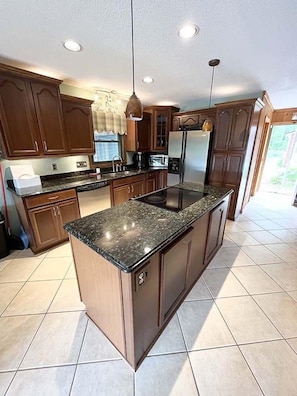 Fully stocked kitchen with granite countertops