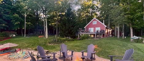 Unique raised stone firepit right at the edge of the lake