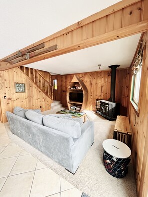 Cozy living room with wood burning fireplace