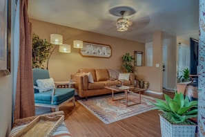 Cozy sofa with unique sandstone side table and large coffee table